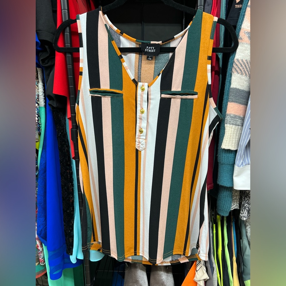 Colorful tank looks great with black dress pants.